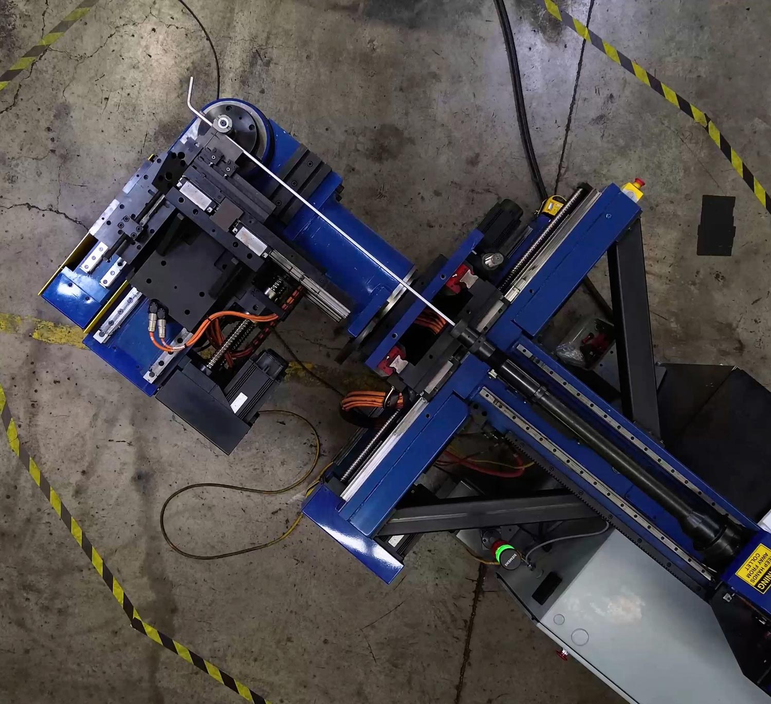 Overhead photo of a CNC tube bender at VBH Tech